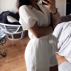 White button up romper with a tie around the waist